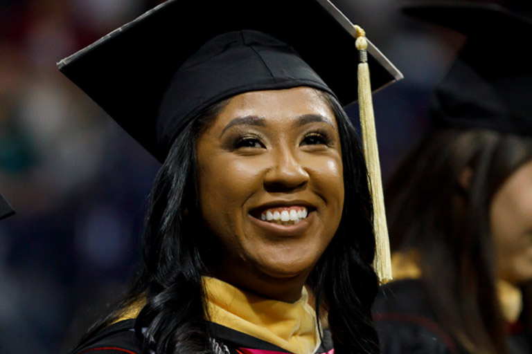 A joyful graduate at Commencement