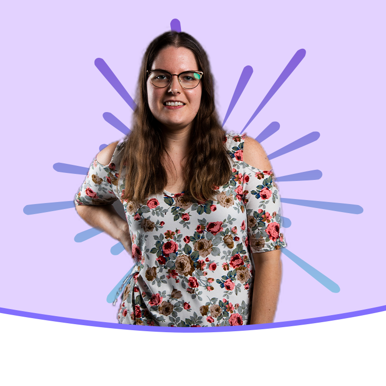 A student smiling for the camera on top of a purple background with a purple gradient burst behind her