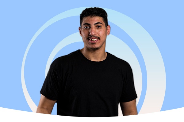 A student in front of a blue background with a gradient swirl behind him