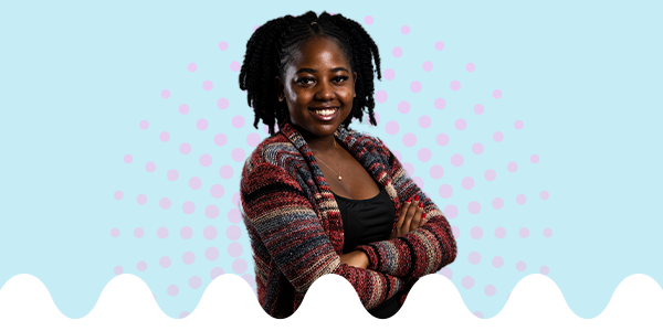 IU South Bend students smiling on top of a gradient circle with a wavy bottom