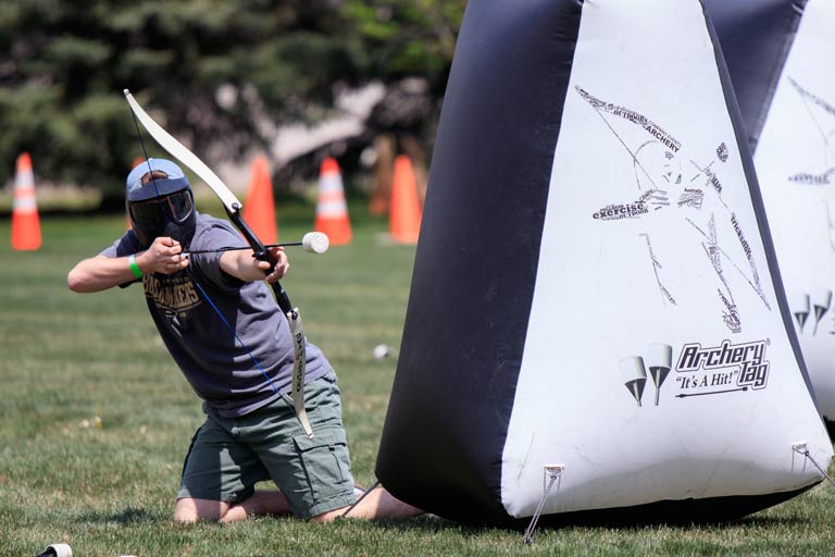 student playing archery tag
